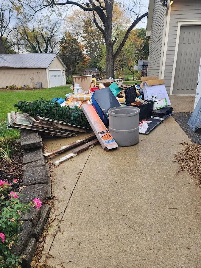 Dumpster being loaded with debris for 3 Yard Dumpster Rental in Cape St. Claire
